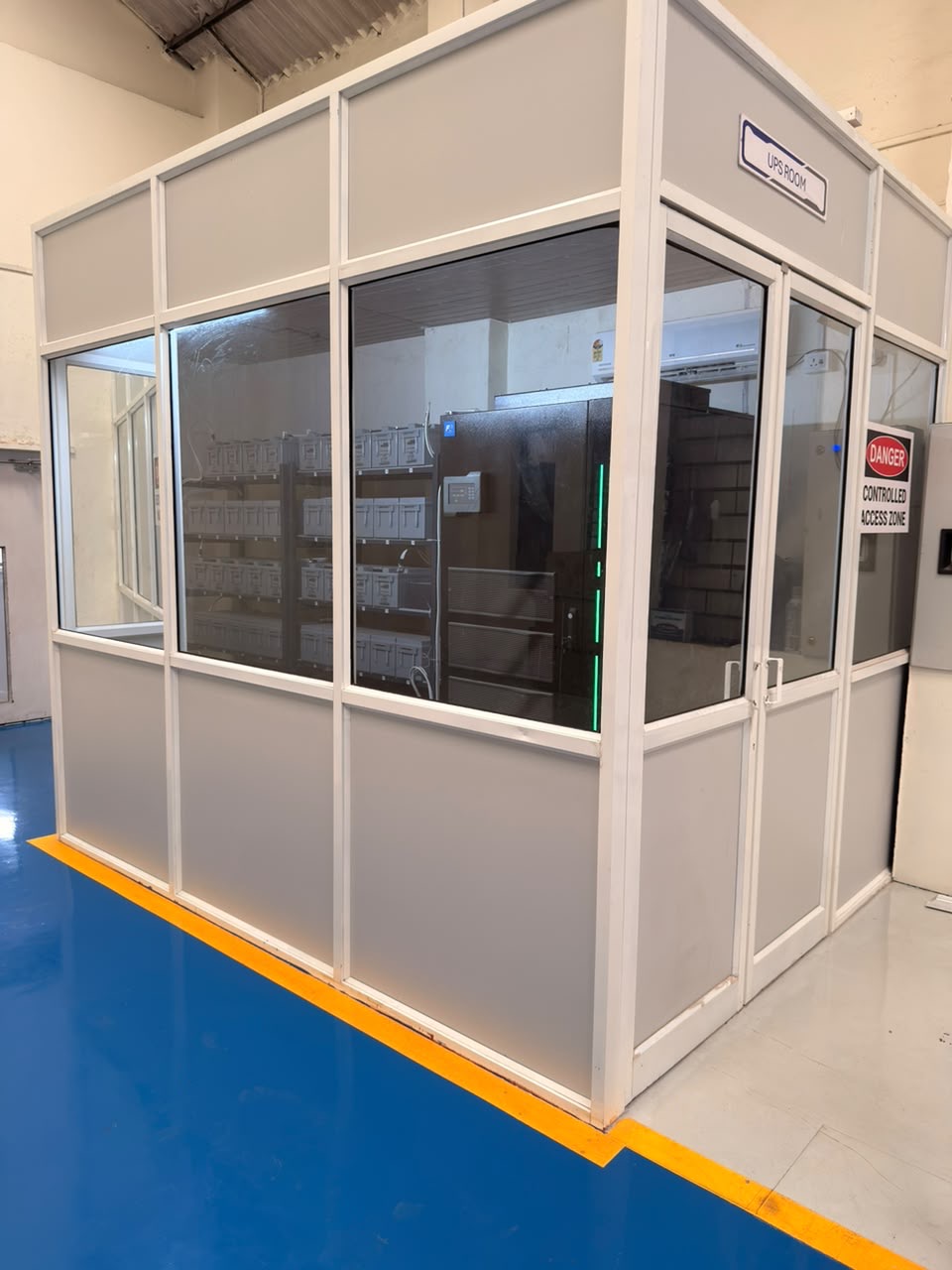 Enclosed UPS room supplying backup power to the shop floor